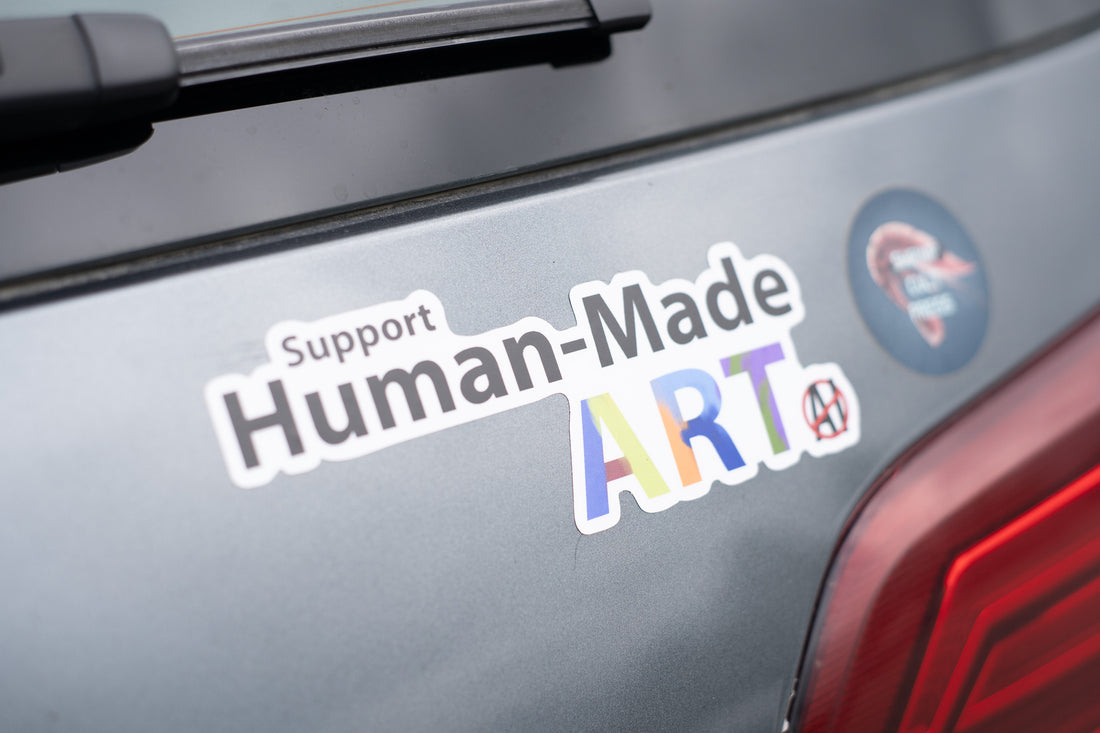 A bumper sticken announcing support for art made my humans. 